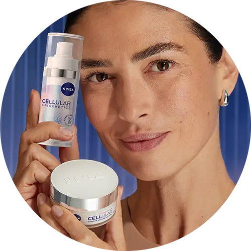 A woman, holding up two products of NIVEA Epigenetics serum and Day Care Cream.