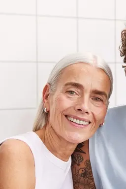 A woman and a man staring to the camera, with nice and bright skin