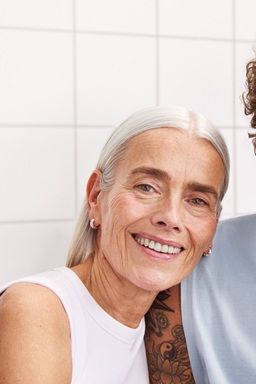 A woman and a man staring to the camera, with nice and bright skin