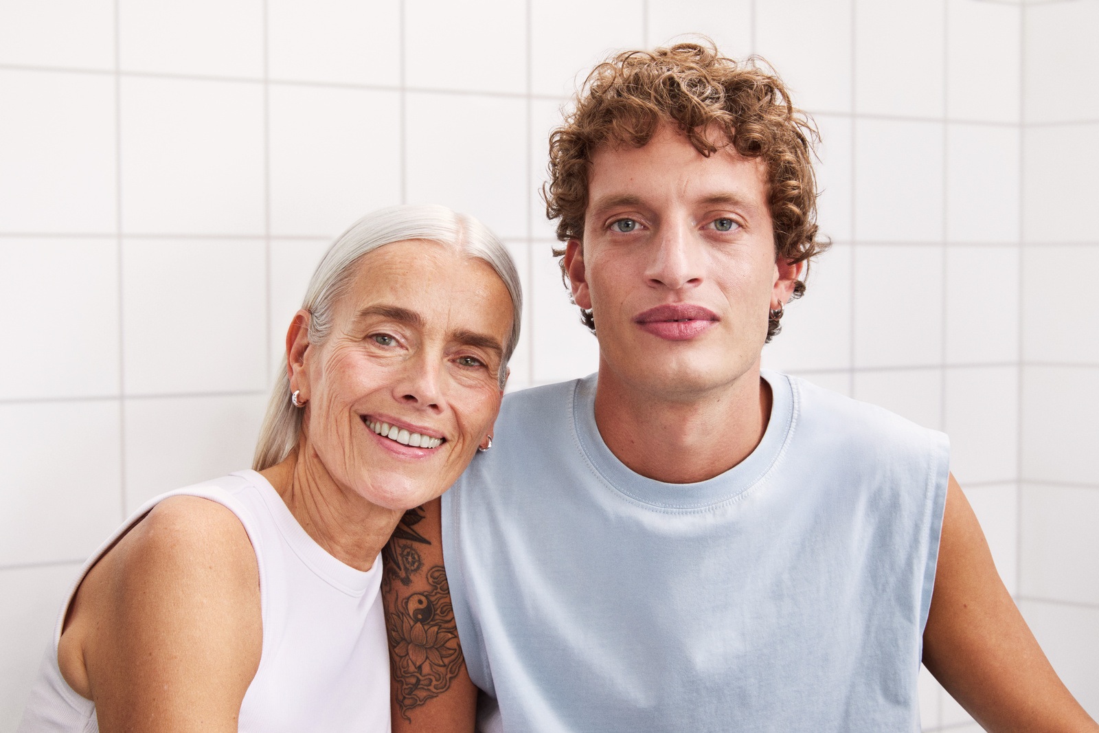 A woman and a man staring to the camera, with nice and bright skin