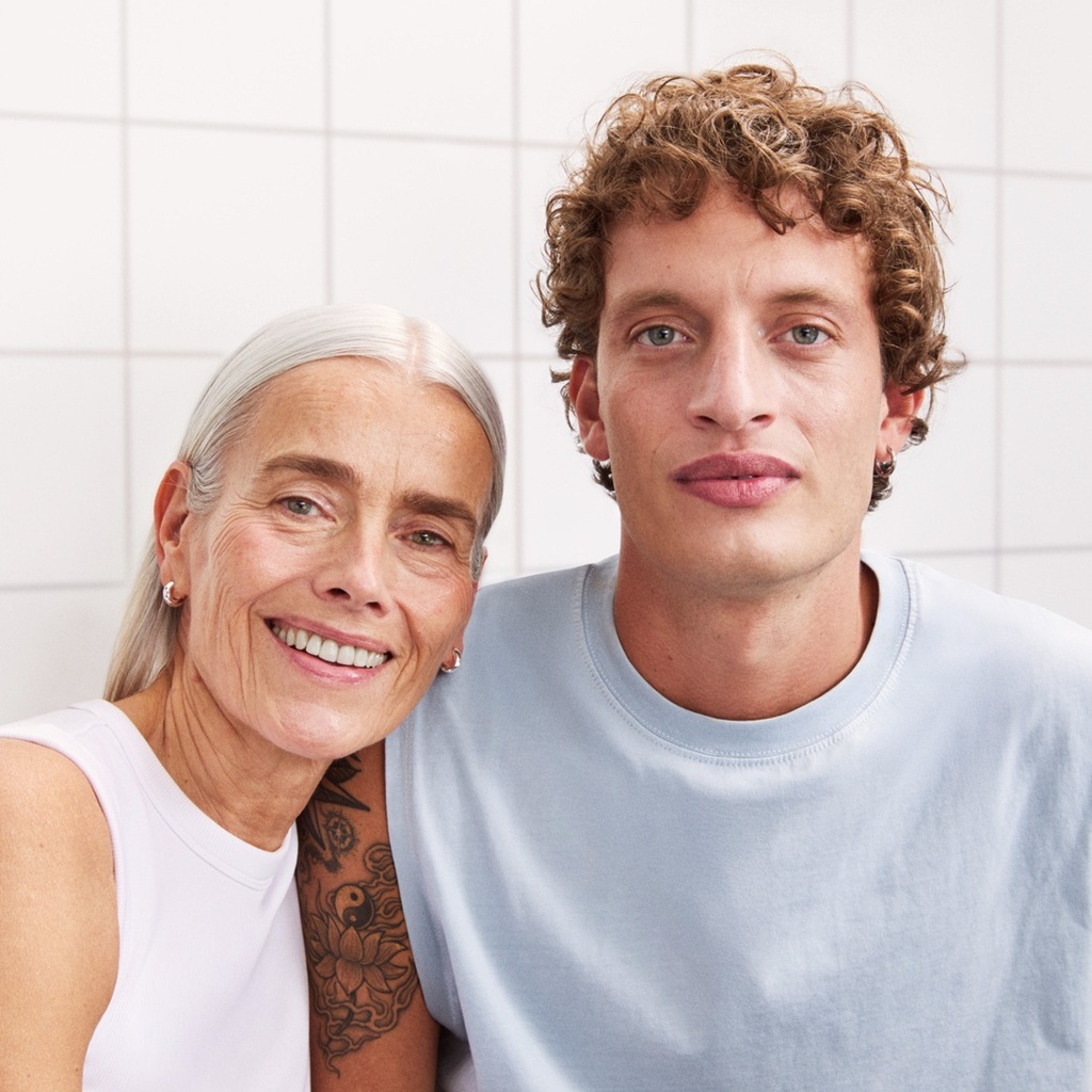 A woman and a man staring to the camera, with nice and bright skin