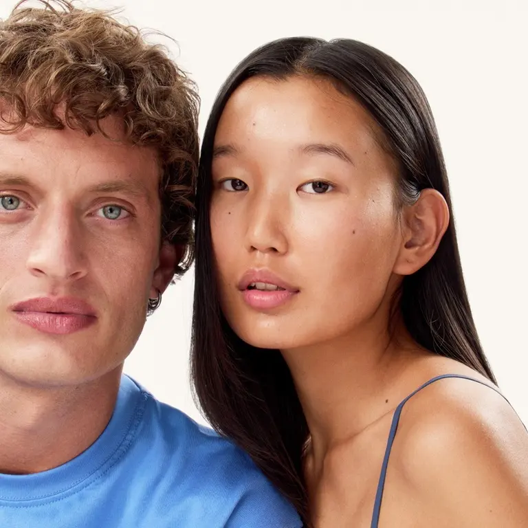 A woman and a man staring to the camera, with nice and bright skin
