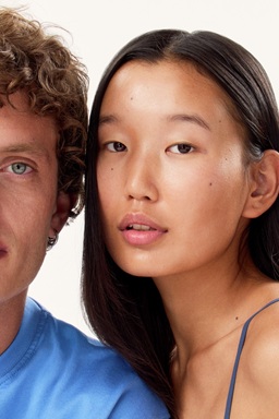 A woman and a man staring to the camera, with nice and bright skin