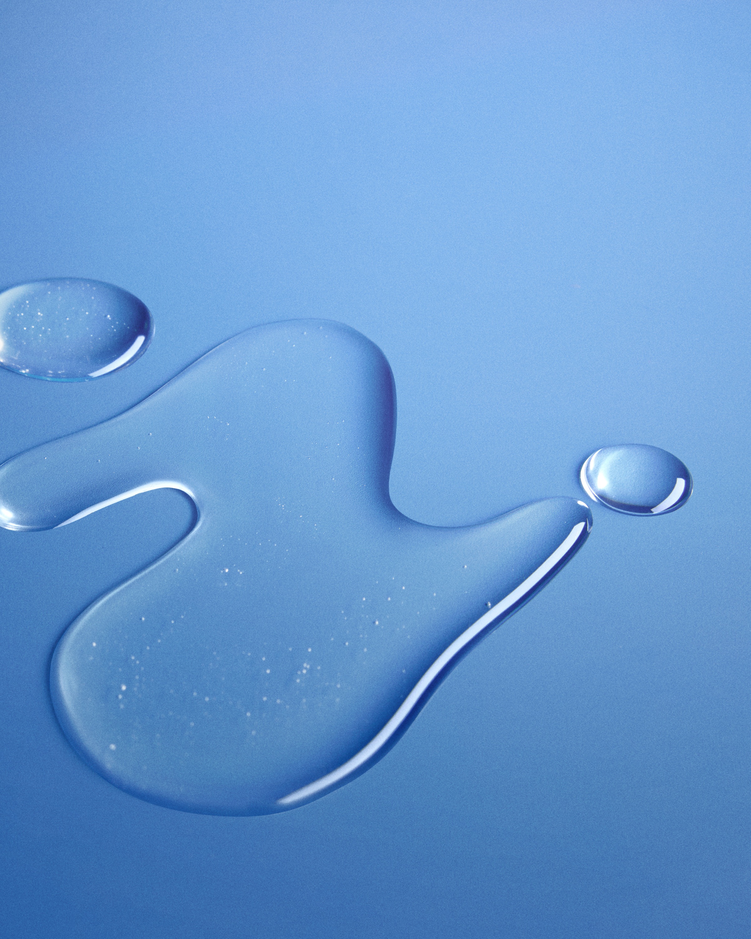 Clear glycerin droplets illustrating glycerin’s role as the skin’s natural moisturizer that hydrates without clogging pores.