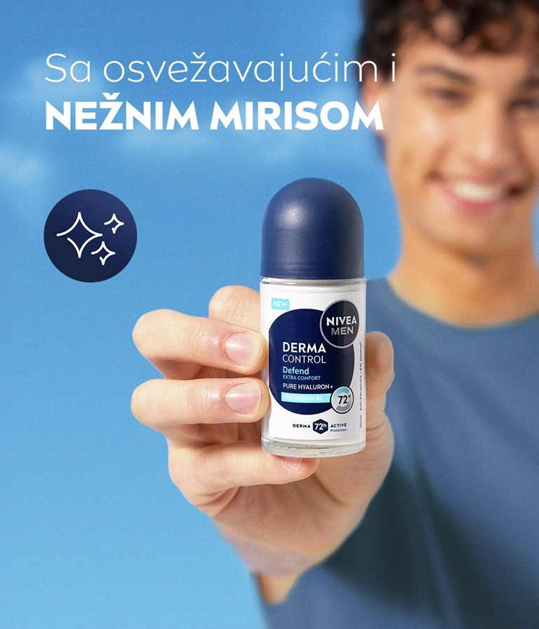 A young man smiles while lifting his arm and applying NIVEA MEN Derma Control Defend Deo Roll-On.