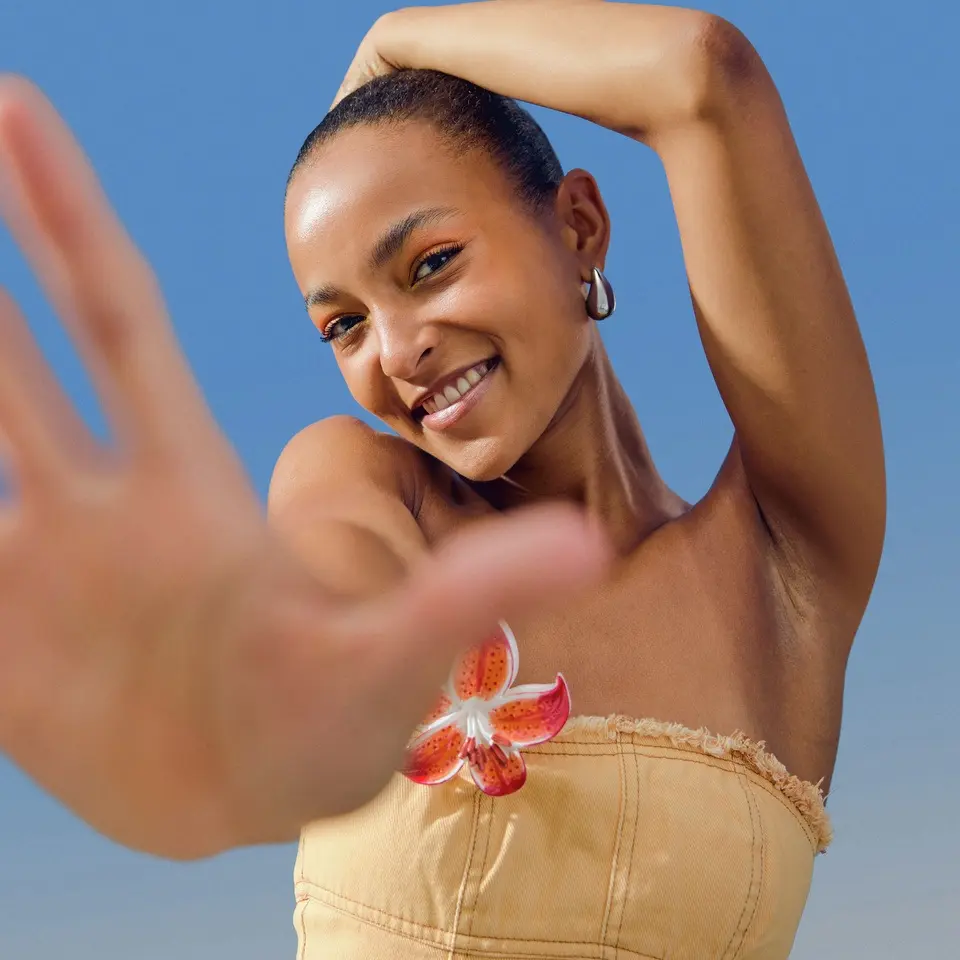 Young woman standing in the sun