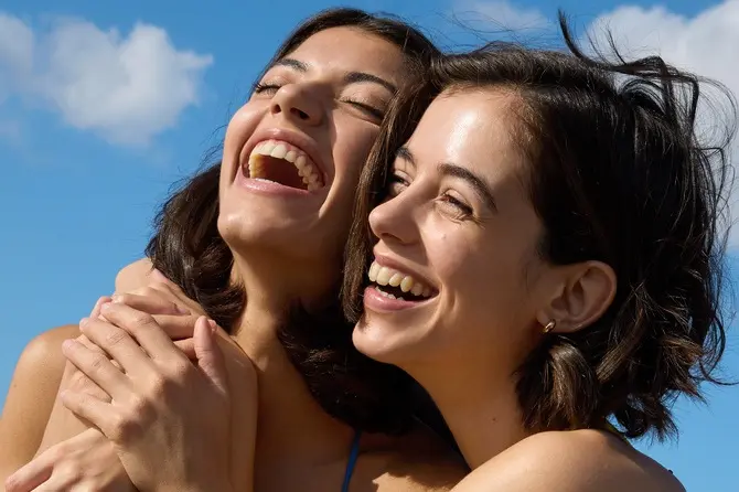Two young girls who smile