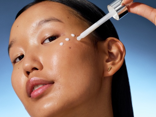 young woman applying serum