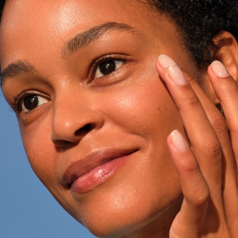 woman applying NIVEA Q10 power anti-wrinkle cream