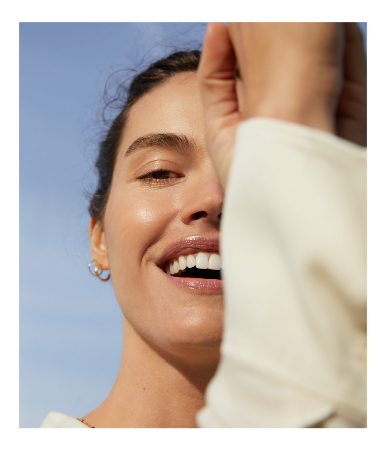 woman holding micellar water serum for bright skin