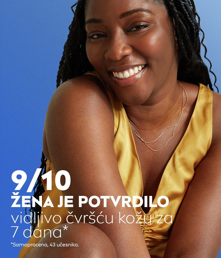 A woman smiles and happy with results from using Q10 skin tightening lotion