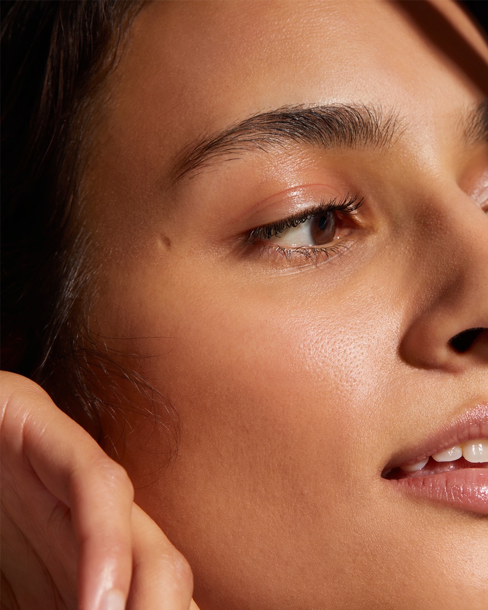 brunette women with peach fuzz on face