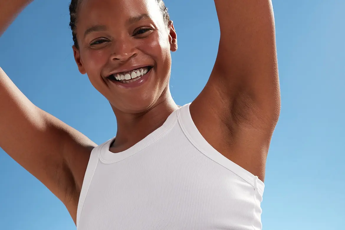 young woman using NIVEA body roll-on
