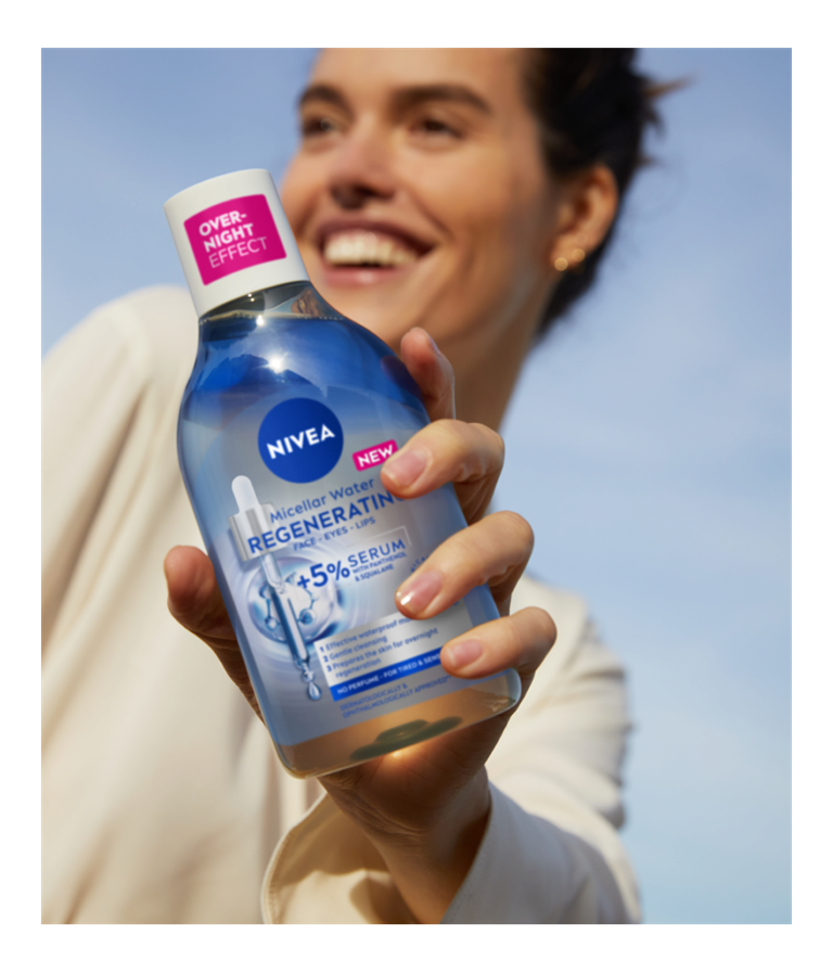 woman holding micellar water serum