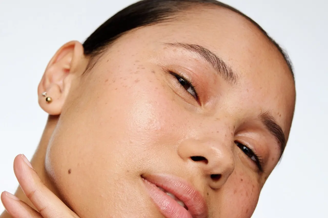 Young lady with blonde hair standing in the sun