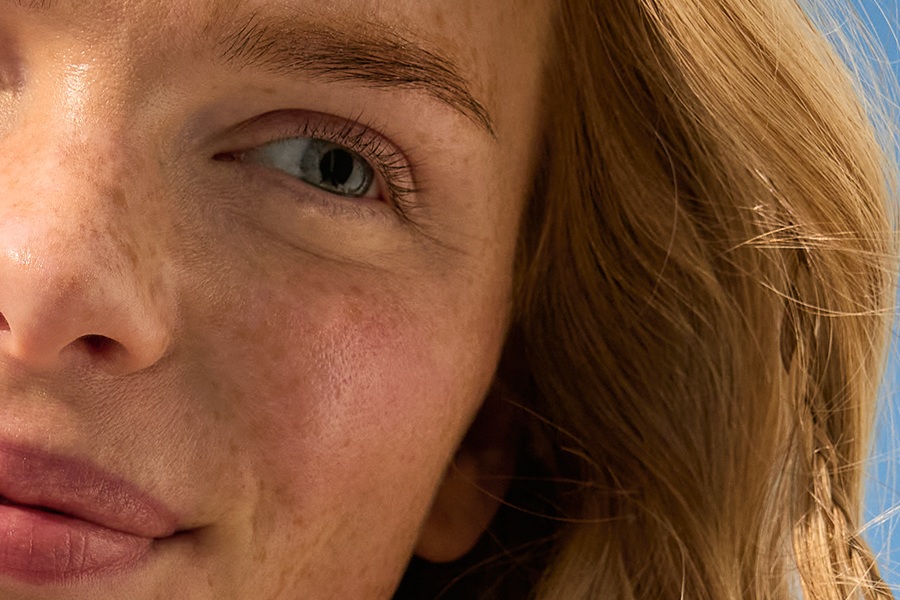 woman with her face in the sun