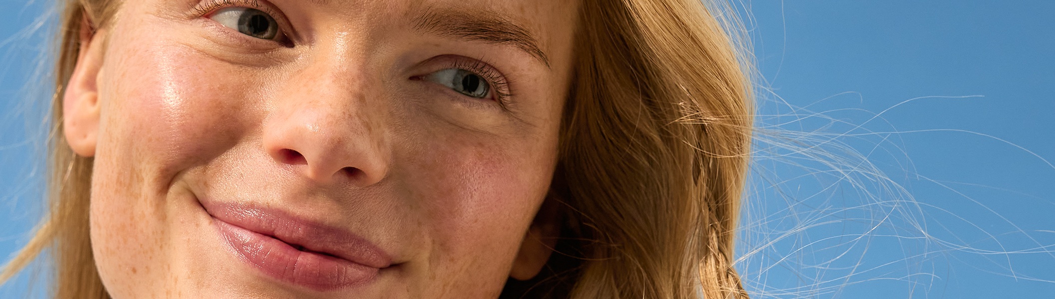 woman with her face in the sun