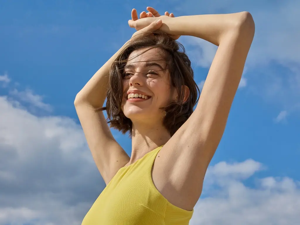 woman using Nivea deodorant