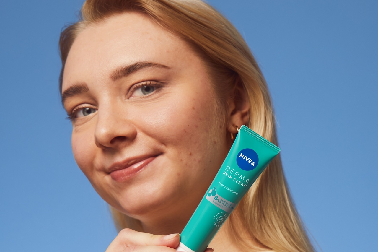 young woman using Nivea Derma Skin Exfoliator
