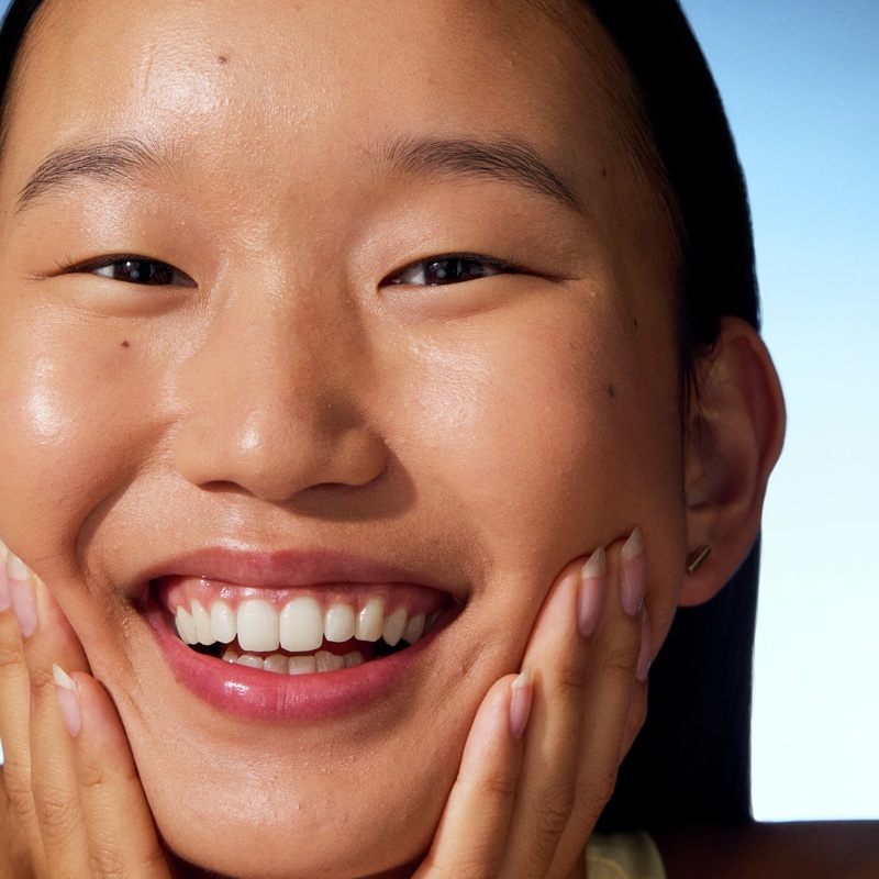 young woman smiling to the camera