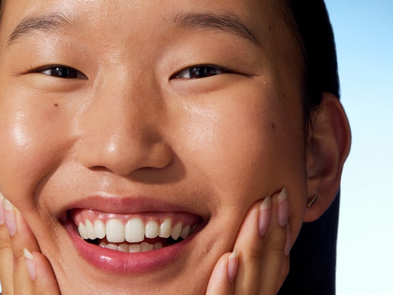 young woman smiling to the camera