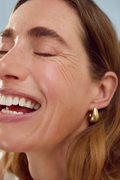 Woman using Nivea Q10 Anti-Wrinkle Power