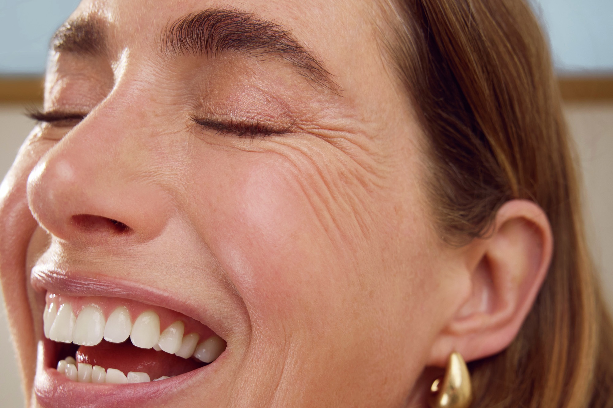 Young woman using Nivea Q10 Anti-Wrinkle Power