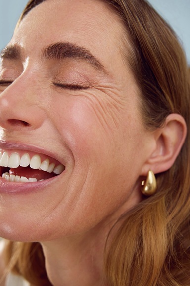 Woman using Nivea Q10 Anti-Wrinkle Power