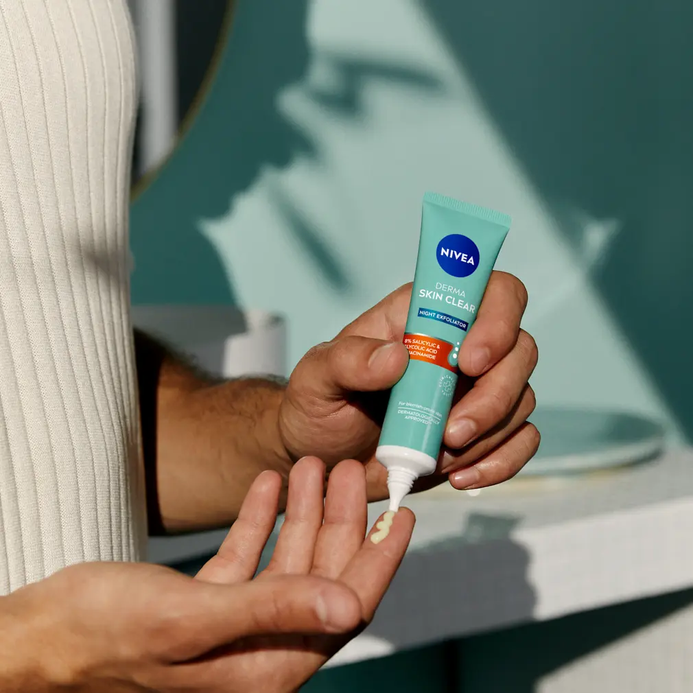 woman using Nivea Derma Skin Toner