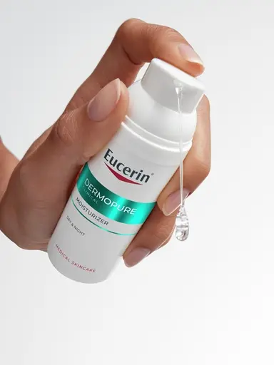 Hand dispensing the Eucerin Probiom8 Moisturizer