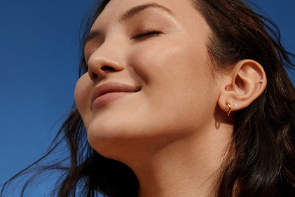 confident looking woman with blemish free skin
