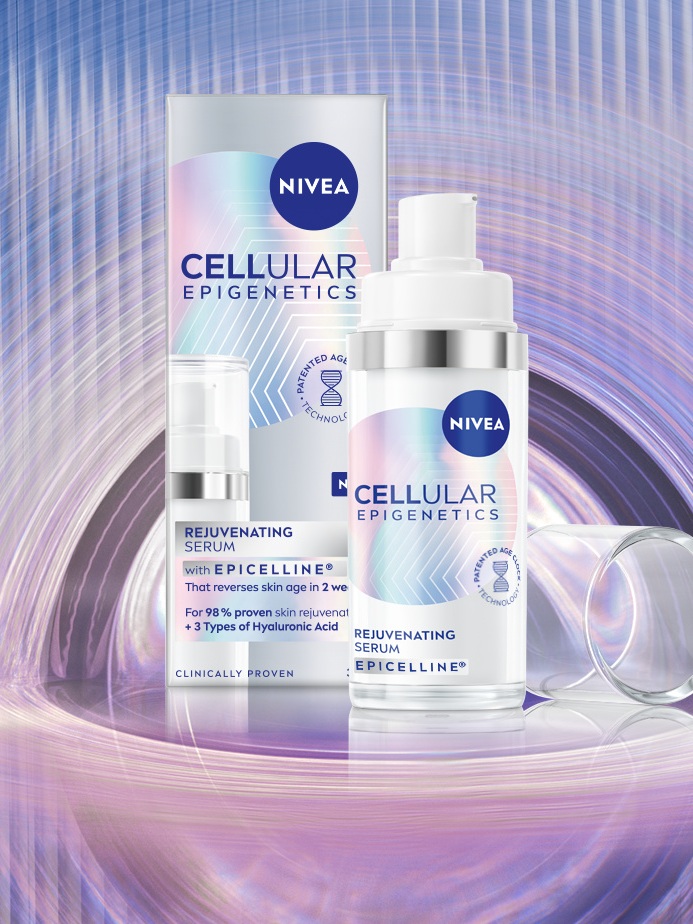 A package and bottle of NIVEA CELLULAR Epigenetics - Rejuvenating Serum with EPICELLINE® is featured in the centre of a lavender ripple.
