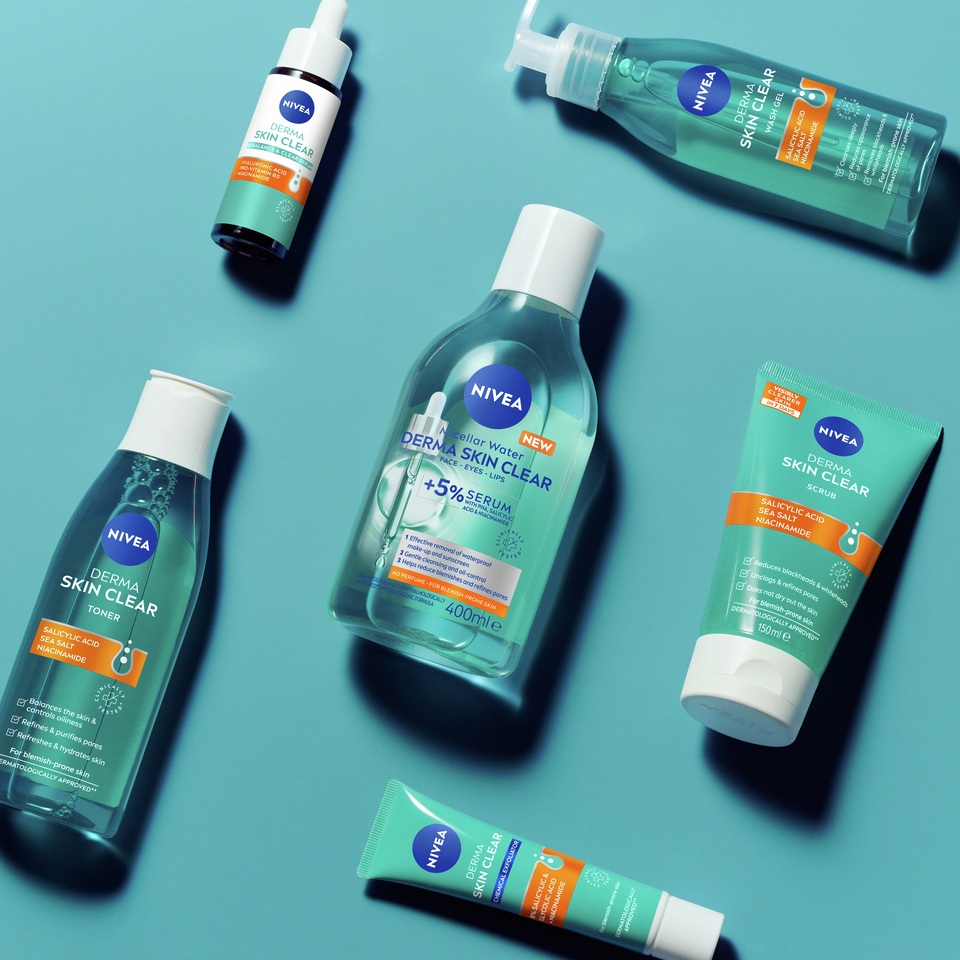 Nivea Derma Skin Clear Skincare Products Displayed on a turquoise background