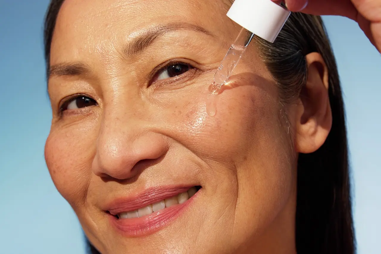 Woman using NIVEA Q10 Anti-Wrinkle POWER EXTRA FIRMING EYE CREAM