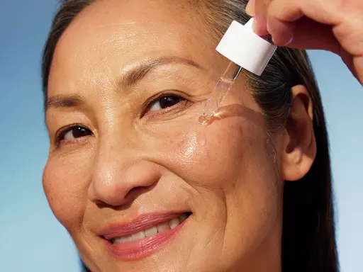 Woman using NIVEA Q10 Anti-Wrinkle POWER EXTRA FIRMING EYE CREAM