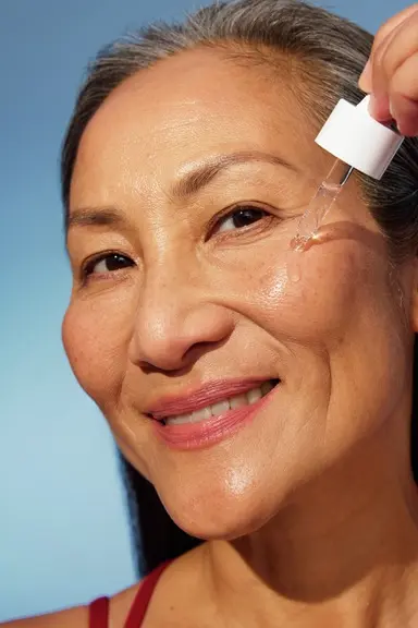Woman using NIVEA Q10 Anti-Wrinkle POWER EXTRA FIRMING EYE CREAM