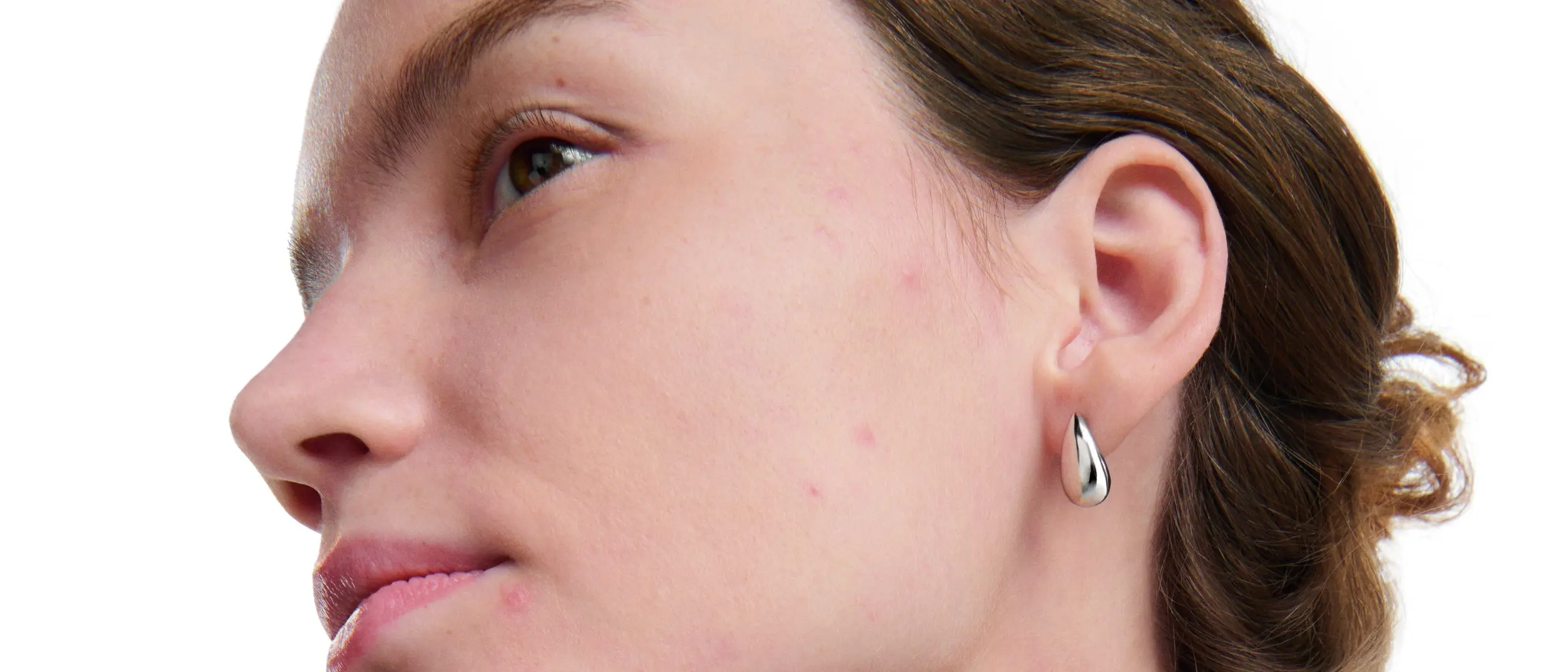 Woman with mild blemishes on acne-prone skin