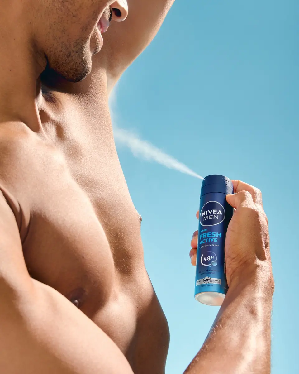 young man using Nivea Men Fresh Sensation deodorant