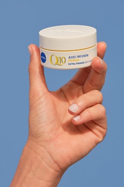 woman applying NIVEA Q10 power anti-wrinkle cream