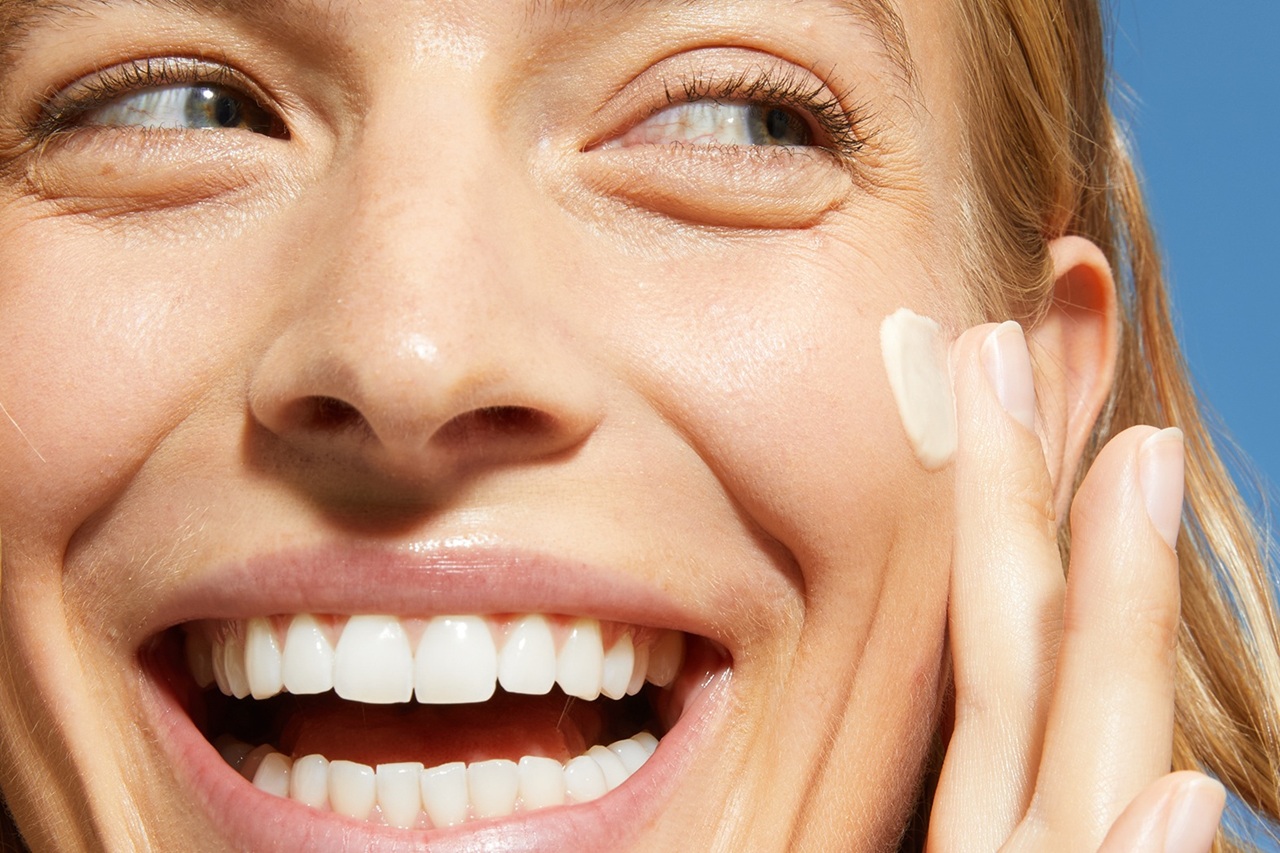 Woman using Primer or BB creams for Tuning step of face care