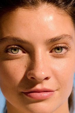 confident looking woman with blemish free skin