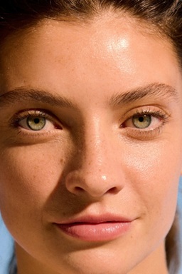 confident looking woman with blemish free skin