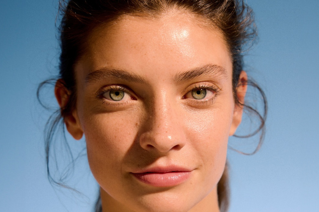 confident looking woman with blemish free skin