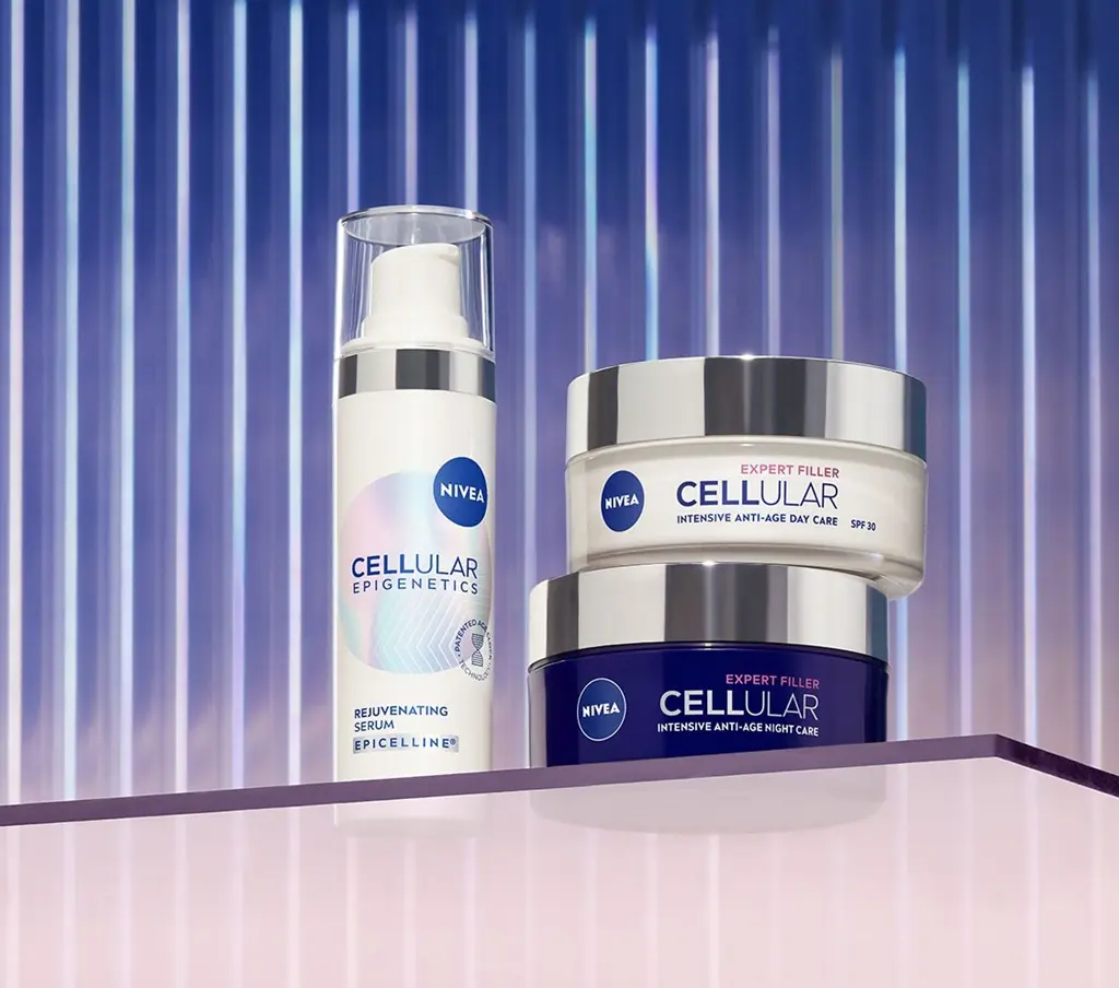 Three products featured on a glass shelf, NIVEA Epigenetics serum, Day Care Cream, and Night Care cream.
