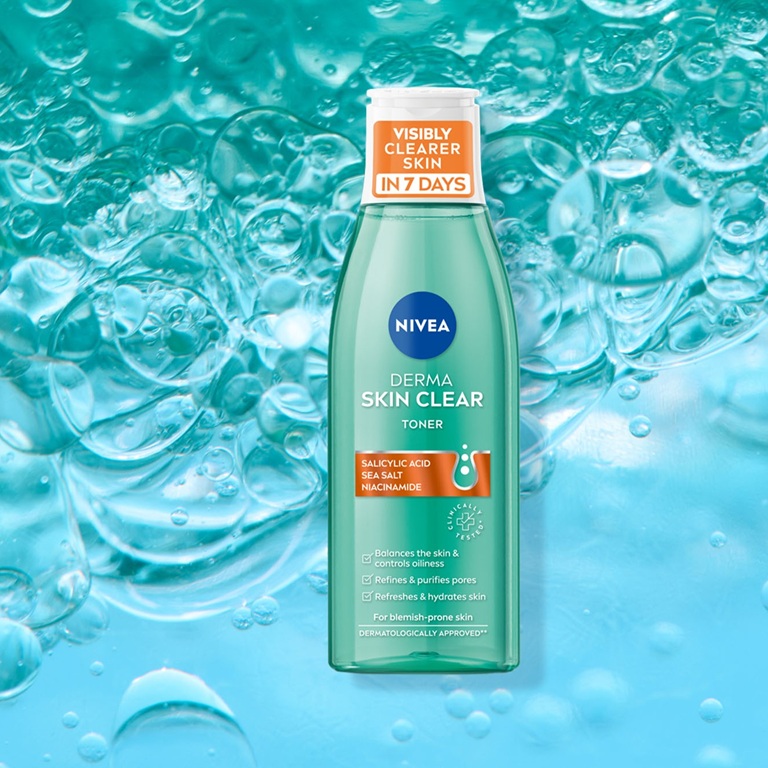 The NIVEA Derma Skin Clear Toner featured over a bright, bubbly teal background.