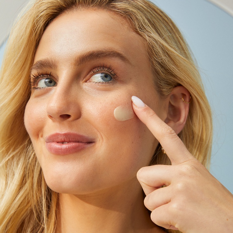 woman using vegan skincare product