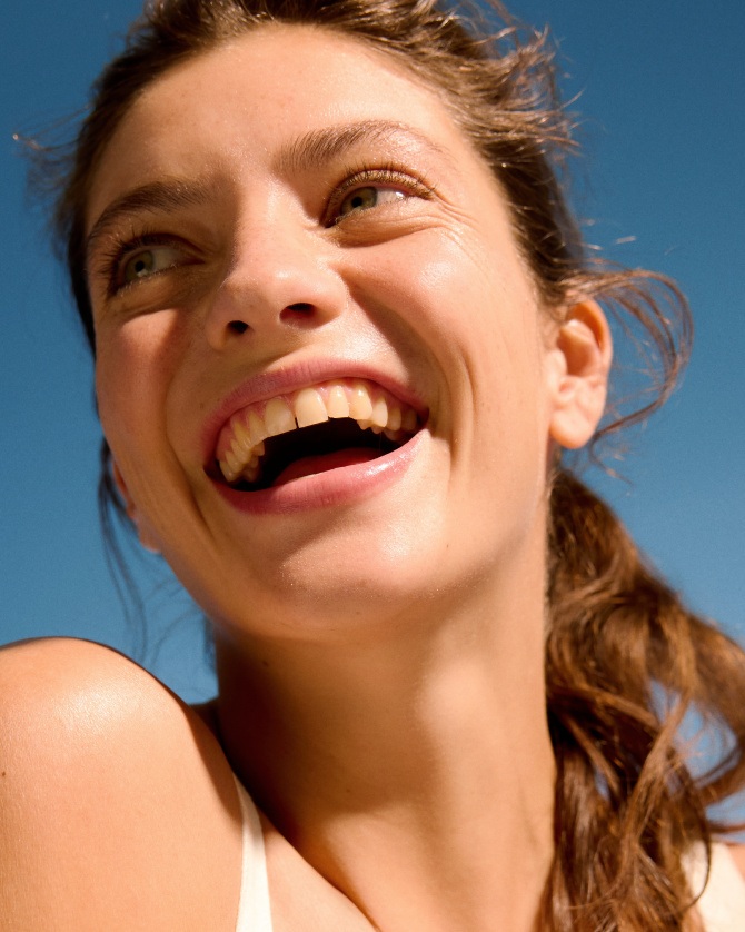 happy woman with cleansed skin