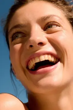 woman with beautiful clear skin laughing