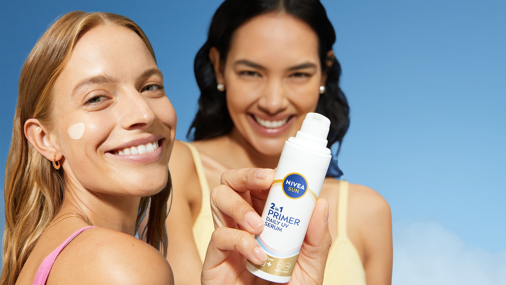 Women smiling and holding NIVEA Sun face Products with UV protection